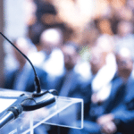 a stock photo of a speaker podium at a conference